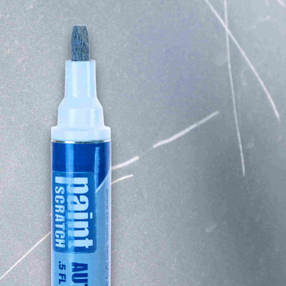 Close-up of a PaintScratch touch up paint pen tip against a scratched car panel, showing the fine nib for small chip repairs.
